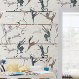 Balancing Act (Cream) wallpaper features colorful dancing monkeys and rabbits on a cream background