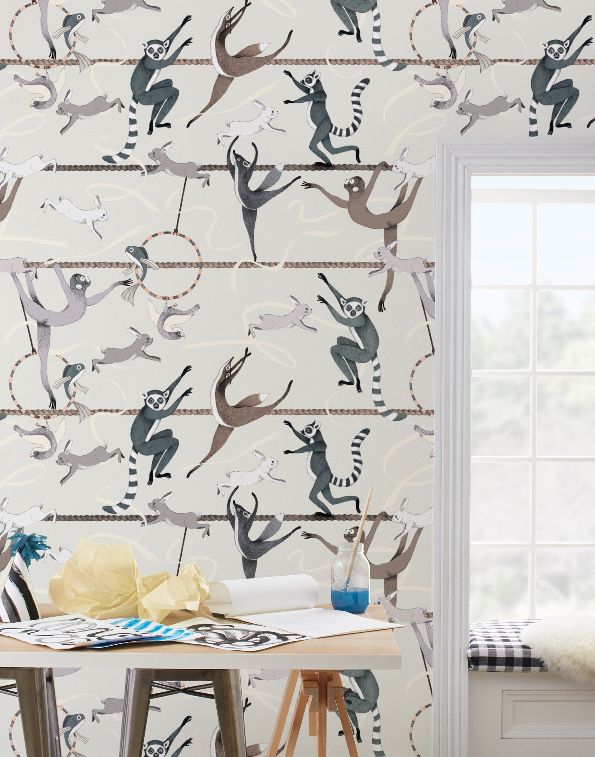 Balancing Act (Cream) wallpaper features colorful dancing monkeys and rabbits on a cream background