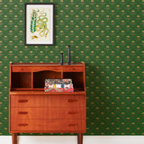 Zinnia (Juniper) Wallpaper mixes a geometric layout with the soft details of the zinnia flower. Yellow, gold, and red illustration on a green ground.