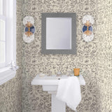 Storyline (Parchment) Wallpaper | Folk art inspired pattern featuring flora and fauna in black on a parchment ground