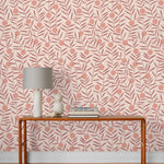 Bloom (Blush) Wallpaper featuring peach dots and mauve stems on a soft pink ground in a modern, graphic floral