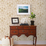 Piedmont (Blush) wallpaper with pink foxes, taupe flora, white accents on a light pink background
