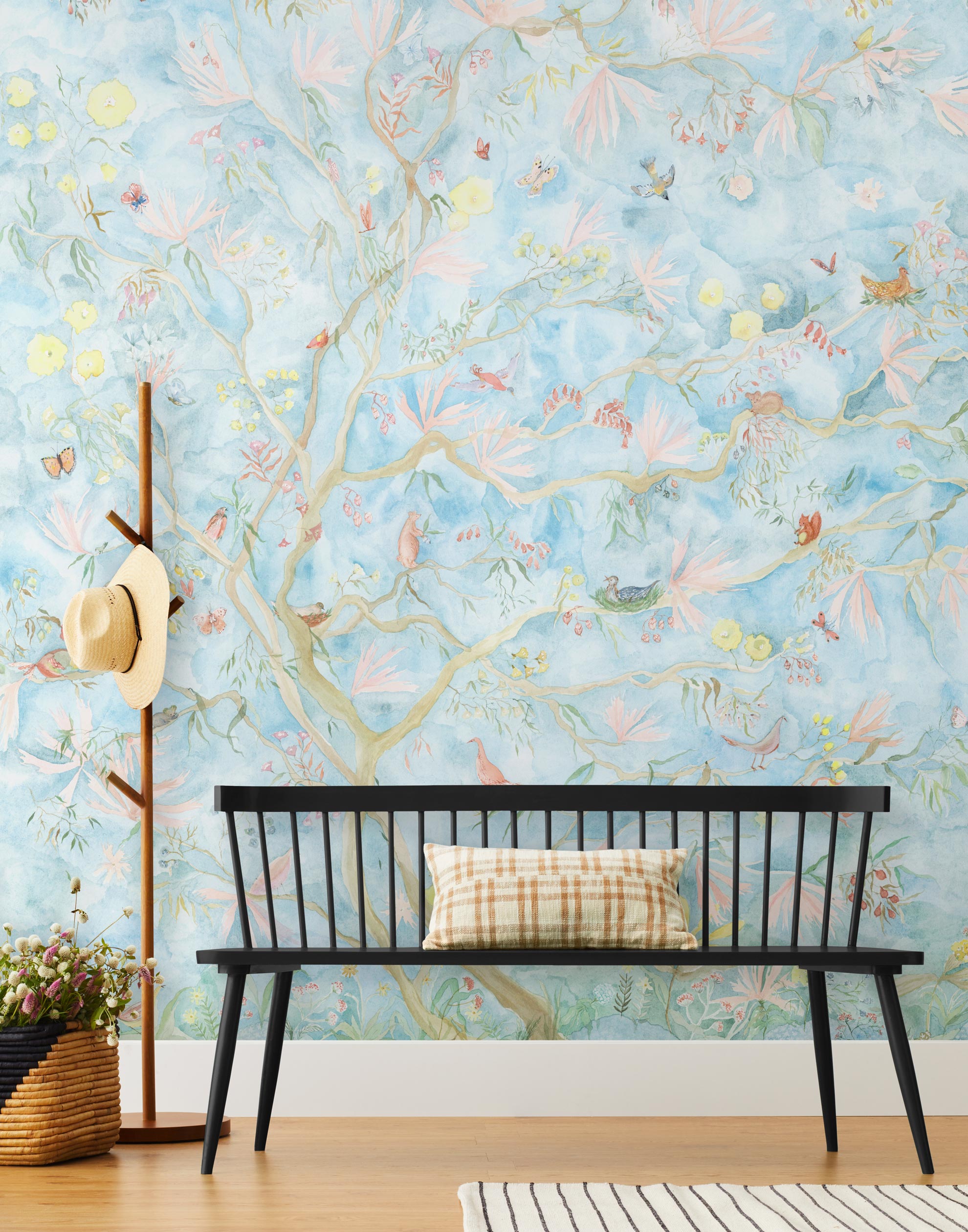 Watercolored birds, butterflies and tree sprites flutter about in an orchard of trees in our Tree Sprites mural. Yellow, pink, peach, and green on a soft blue background. Hillery Sproat + Hygge & West