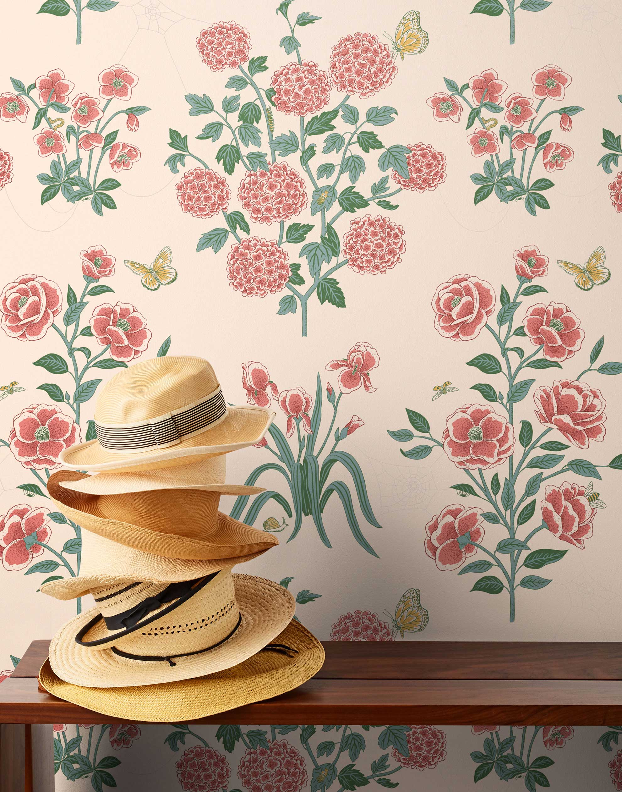 This large-scale wallpaper features hand drawn bees, butterflies and other garden friends frolic among flowers - camellias, hellebores, irises, and snowball trees. Harmony (Blush) is printed in shades of green and pink on a blush background.