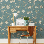 Our In the Stars wallpaper is inspired by Urania’s Mirror, a 19th-century set of astrology charts. This hand-drawn pattern evokes the mysterious motion of celestial bodies. This wallpaper features cream and gold motifs on a blue background and was designed by Julia Rothman.