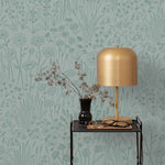 Alpine Garden Tonal (Mist) featuring hand drawn flowers in green on a dusty blue background | Schoolhouse x Hygge & West Wallpaper Collection