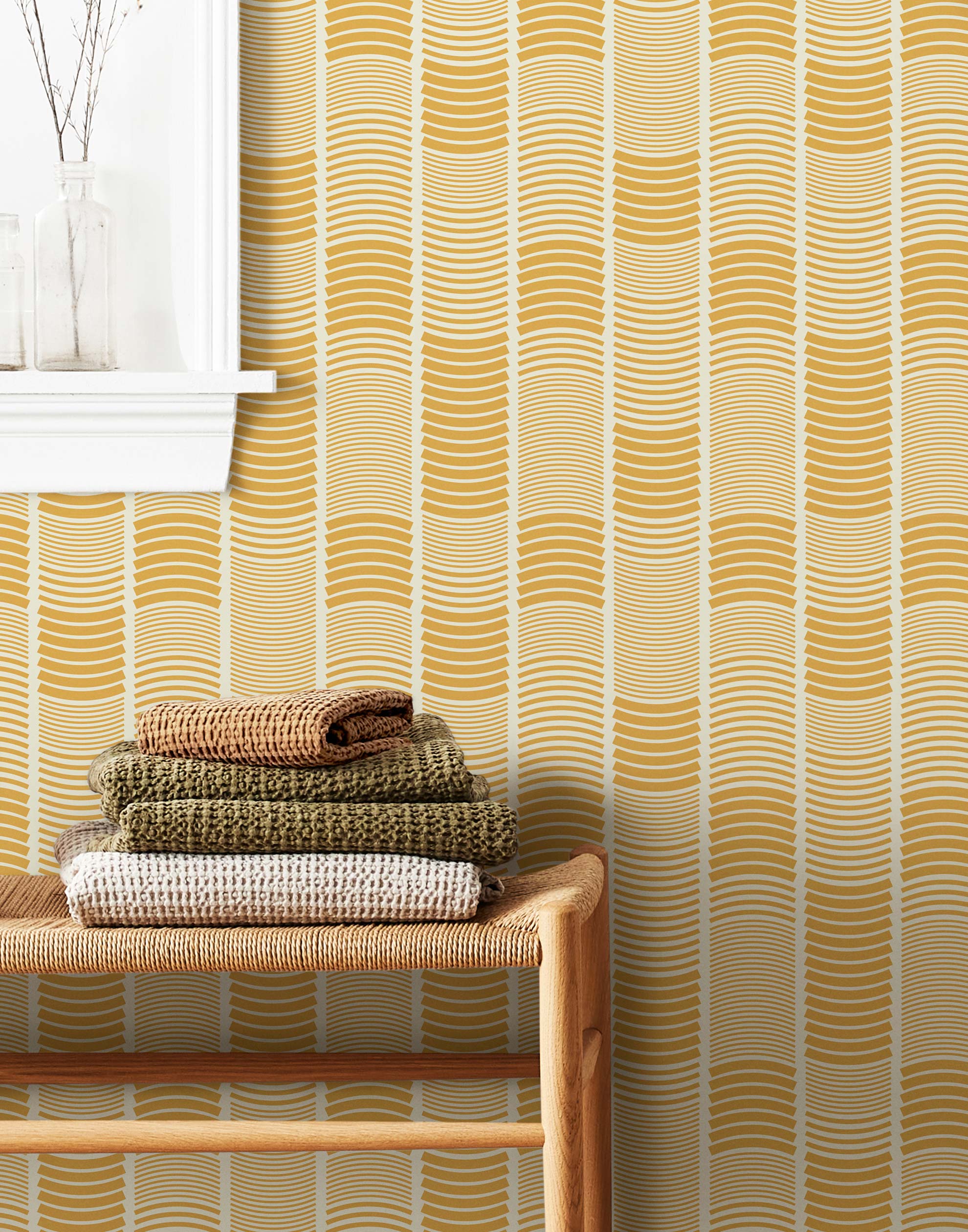 Wallpaper with undulating mustard yellow lines that form rhythmic columns on a white background | Schoolhouse + Hygge & West