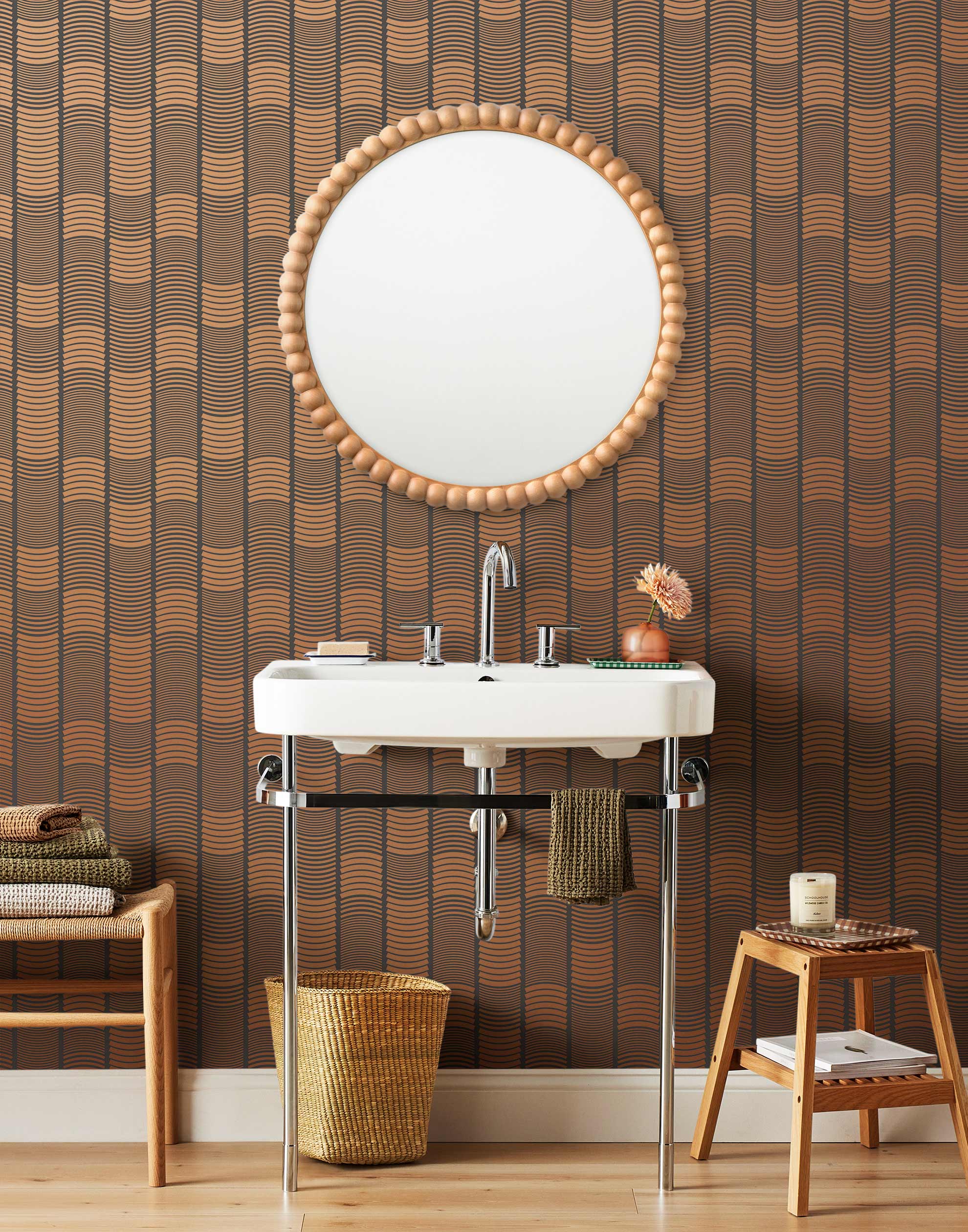 Wallpaper with undulating copper lines that form rhythmic columns on a dark gray background | Schoolhouse + Hygge & West