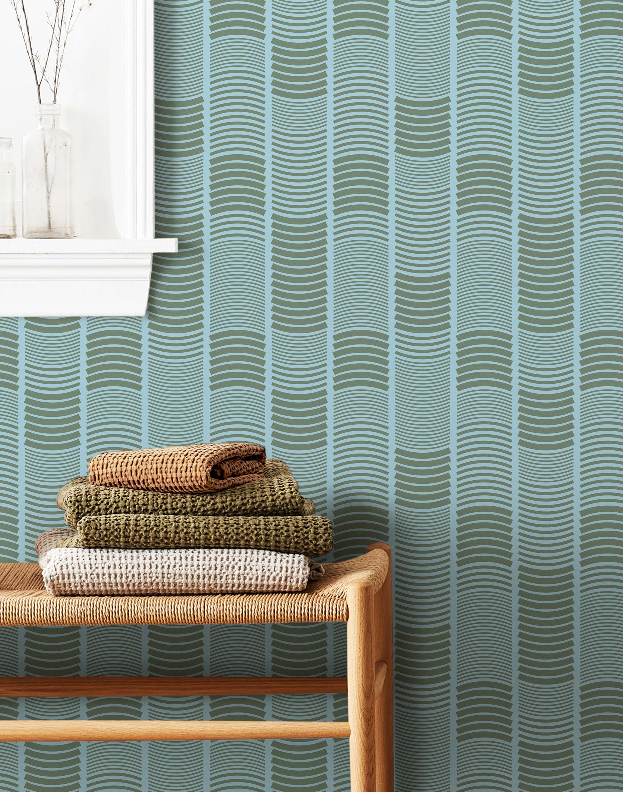 Wallpaper with undulating green lines that form rhythmic columns on a blue background | Schoolhouse + Hygge & West