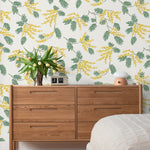 Wallpaper with yellow acacia flowers and green leaves on an off white background | Schoolhouse + Hygge & West