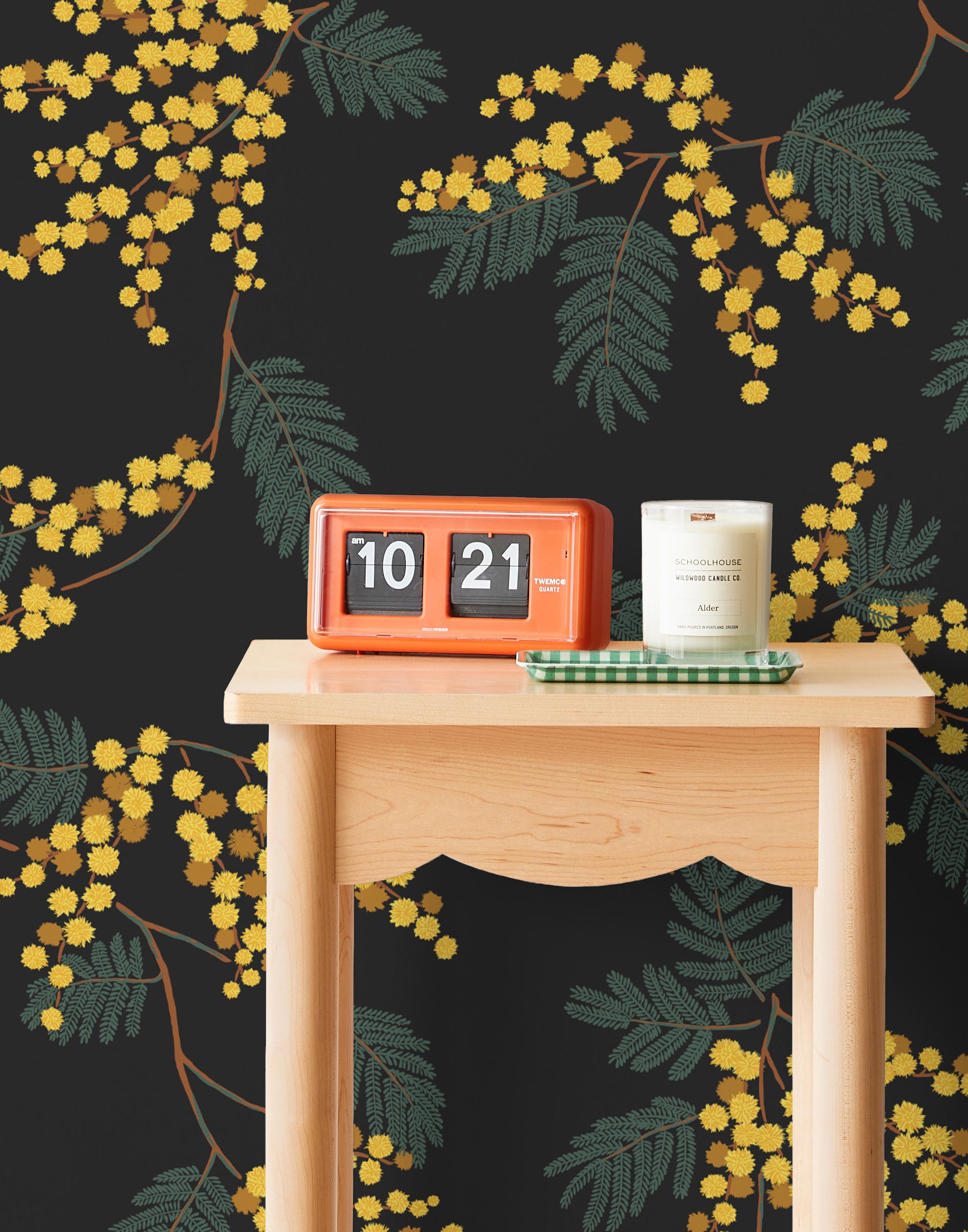 Wallpaper with yellow acacia flowers and green leaves on a soft black background | Schoolhouse + Hygge & West