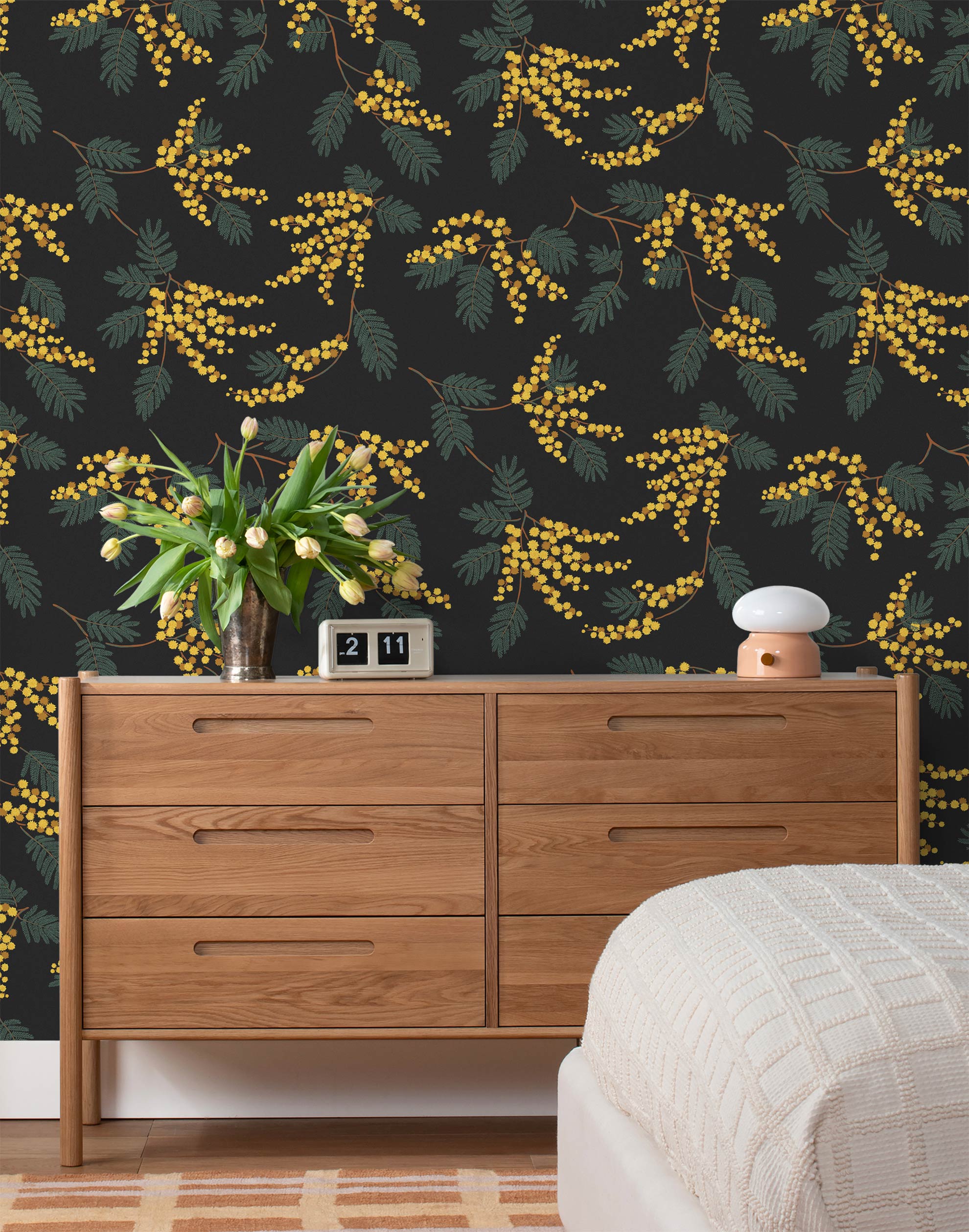 Wallpaper with yellow acacia flowers and green leaves on a soft black background | Schoolhouse + Hygge & West