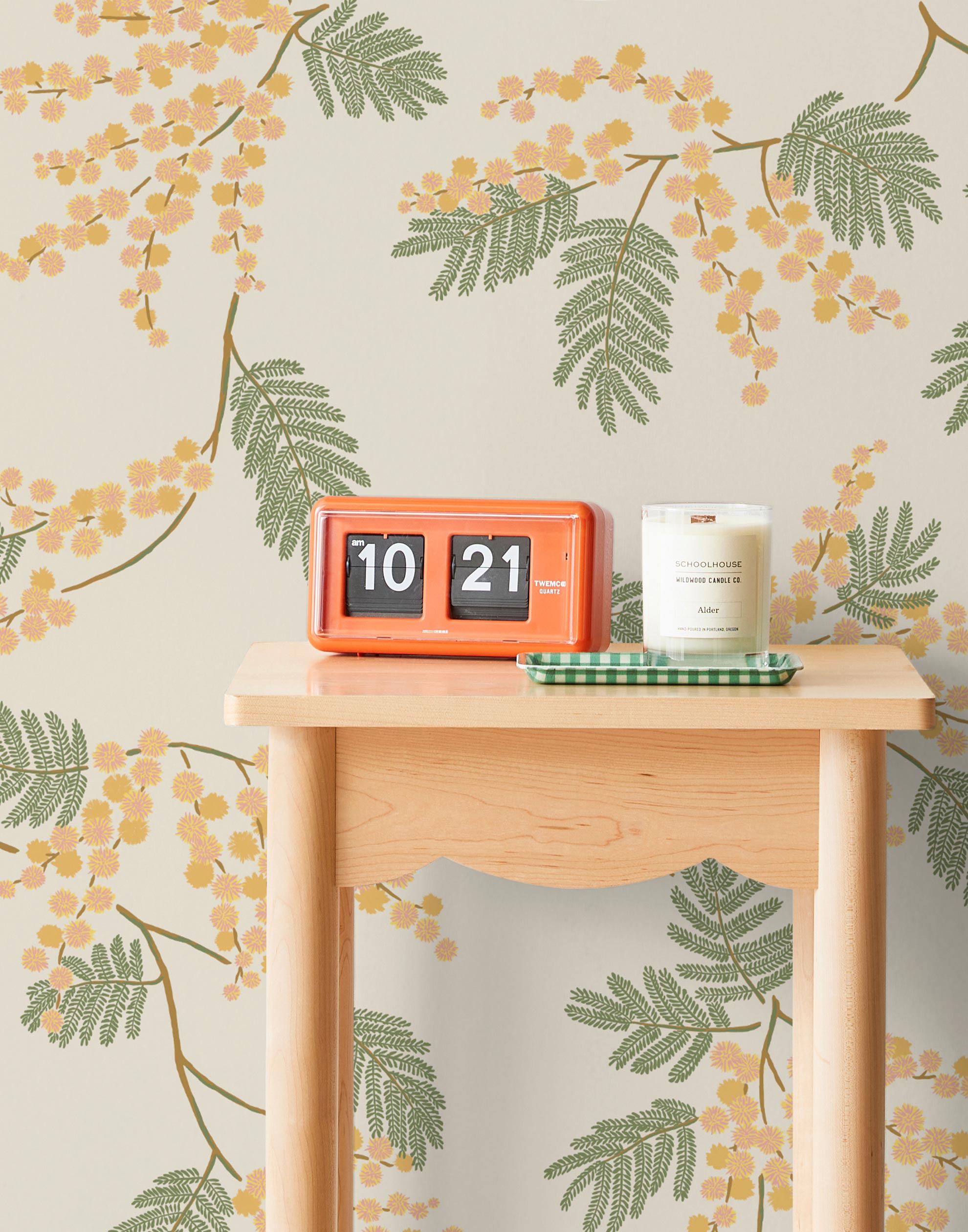 Wallpaper with coral and pink acacia flowers and green leaves on a cream background | Schoolhouse + Hygge & West