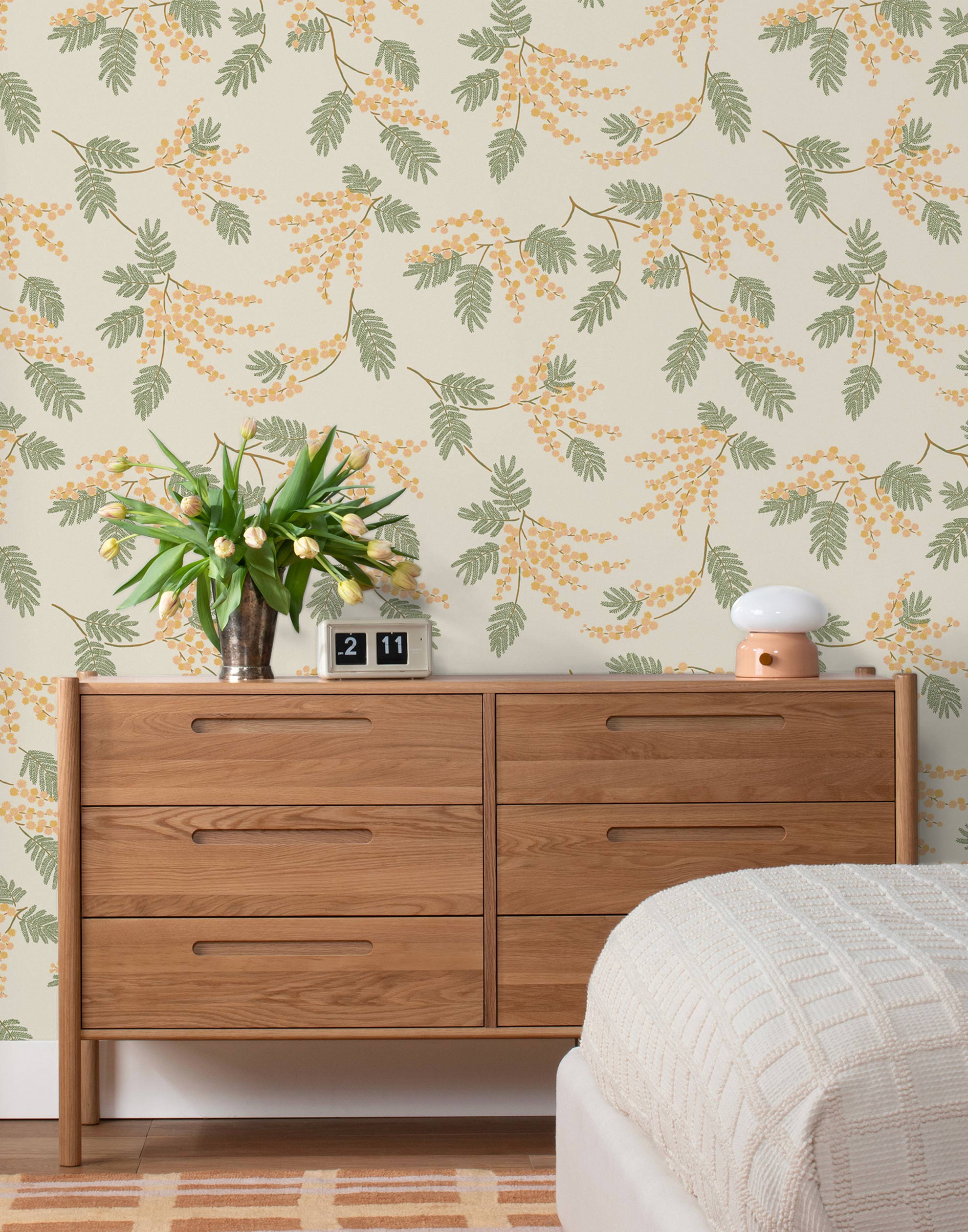 Wallpaper with coral and pink acacia flowers and green leaves on a cream background | Schoolhouse + Hygge & West