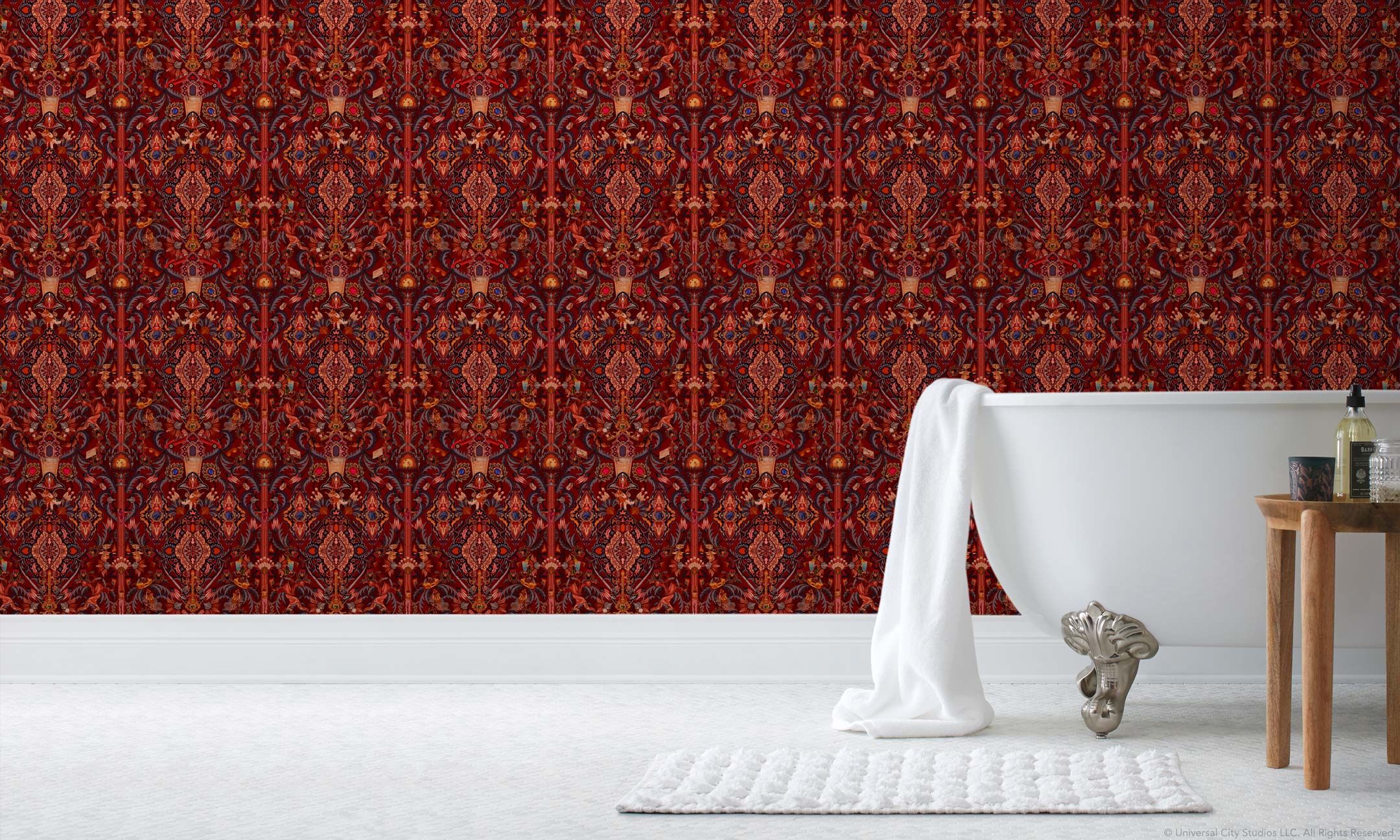 Inspired by The Big Lebowski’s singular characters, "striking" imagery, and oft-quoted dialogue, Abide Wallpaper is a visual feast of iconic movie moments. Red background designed to interpret a rug with hidden characters and scenes form the movie in blue, gray, pink, and orange. Universal + Hygge & West