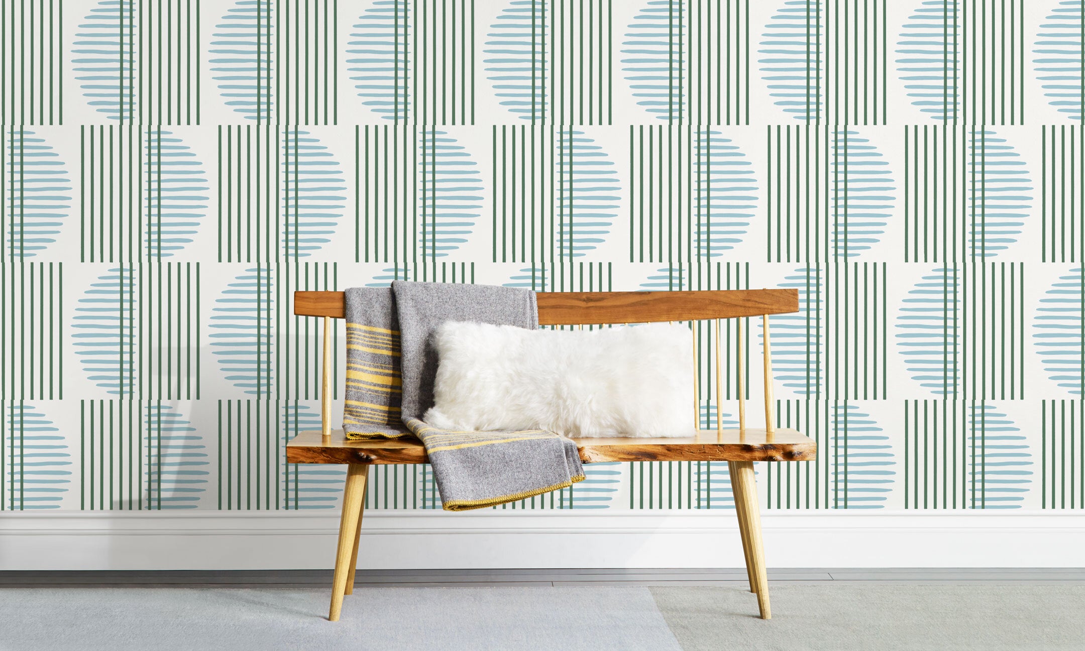 Wallpaper with irregular line work that weaves greenr rectangles and blue semicircles on a white background | Before and after