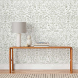Storyline (Sage) Wallpaper | Folk art inspired pattern featuring flora and fauna. Before and after.