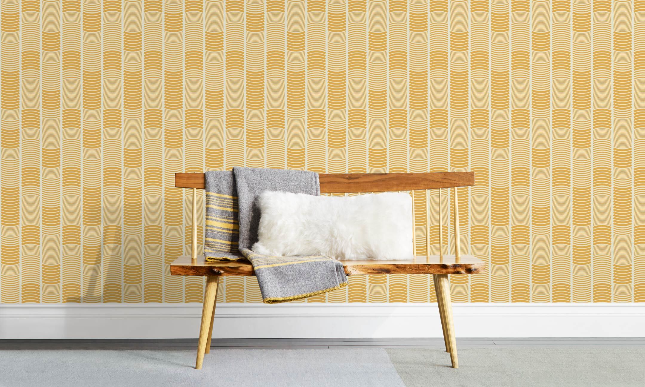 Wallpaper with undulating yellow lines that form rhythmic columns on a white background | Schoolhouse + Hygge & West