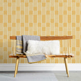 Wallpaper with undulating yellow lines that form rhythmic columns on a white background | Schoolhouse + Hygge & West