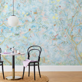 Watercolored birds, butterflies and tree sprites flutter about in an orchard of trees in our Tree Sprites mural. Yellow, pink, peach, and green on a soft blue background. Before and after.