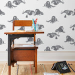 Mighty (Charcoal) wallpaper features gray lions and meerkats on a white background