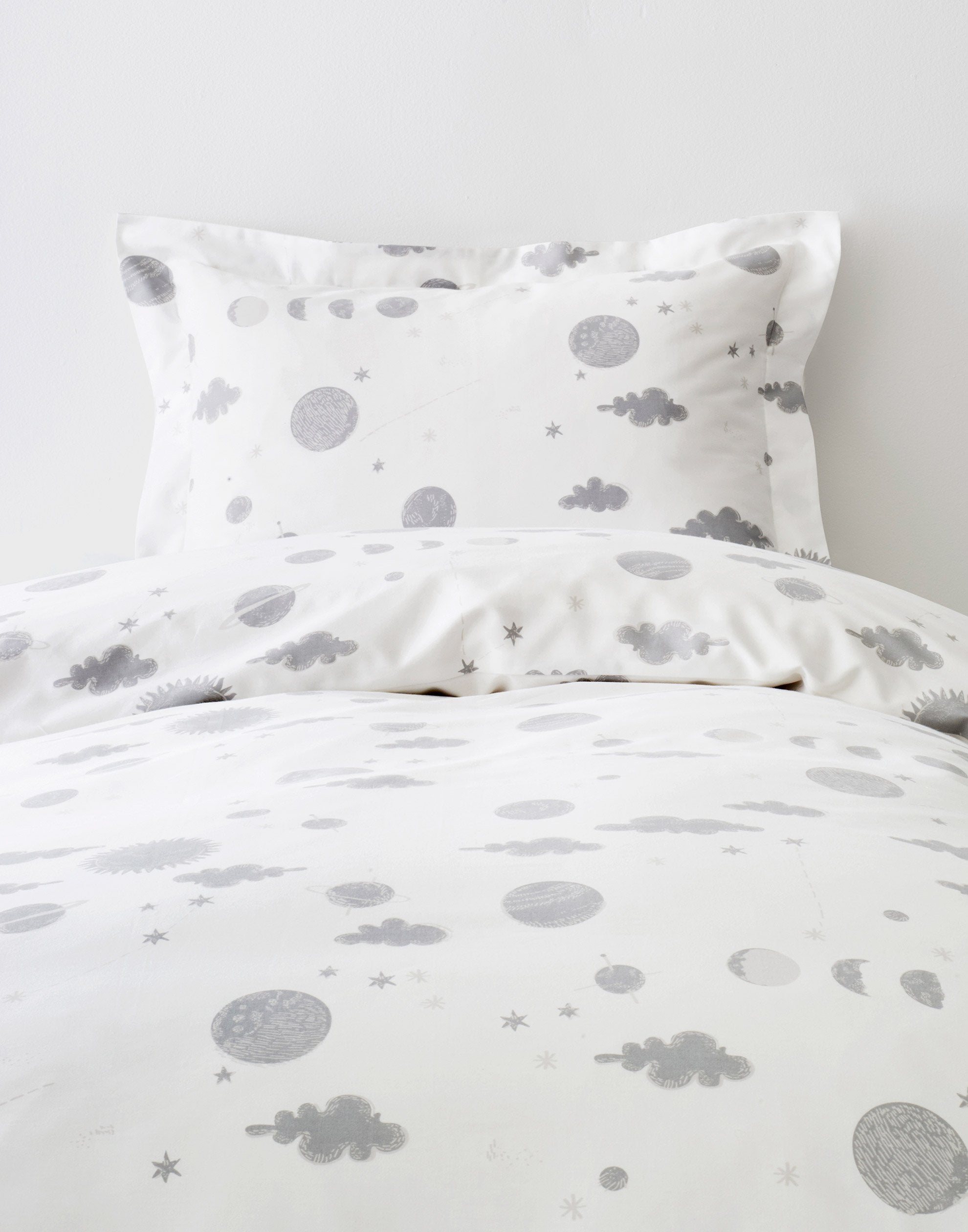 Orbit (Gray) Twin Duvet Set features gray moons, clouds and stars on a soft white background
