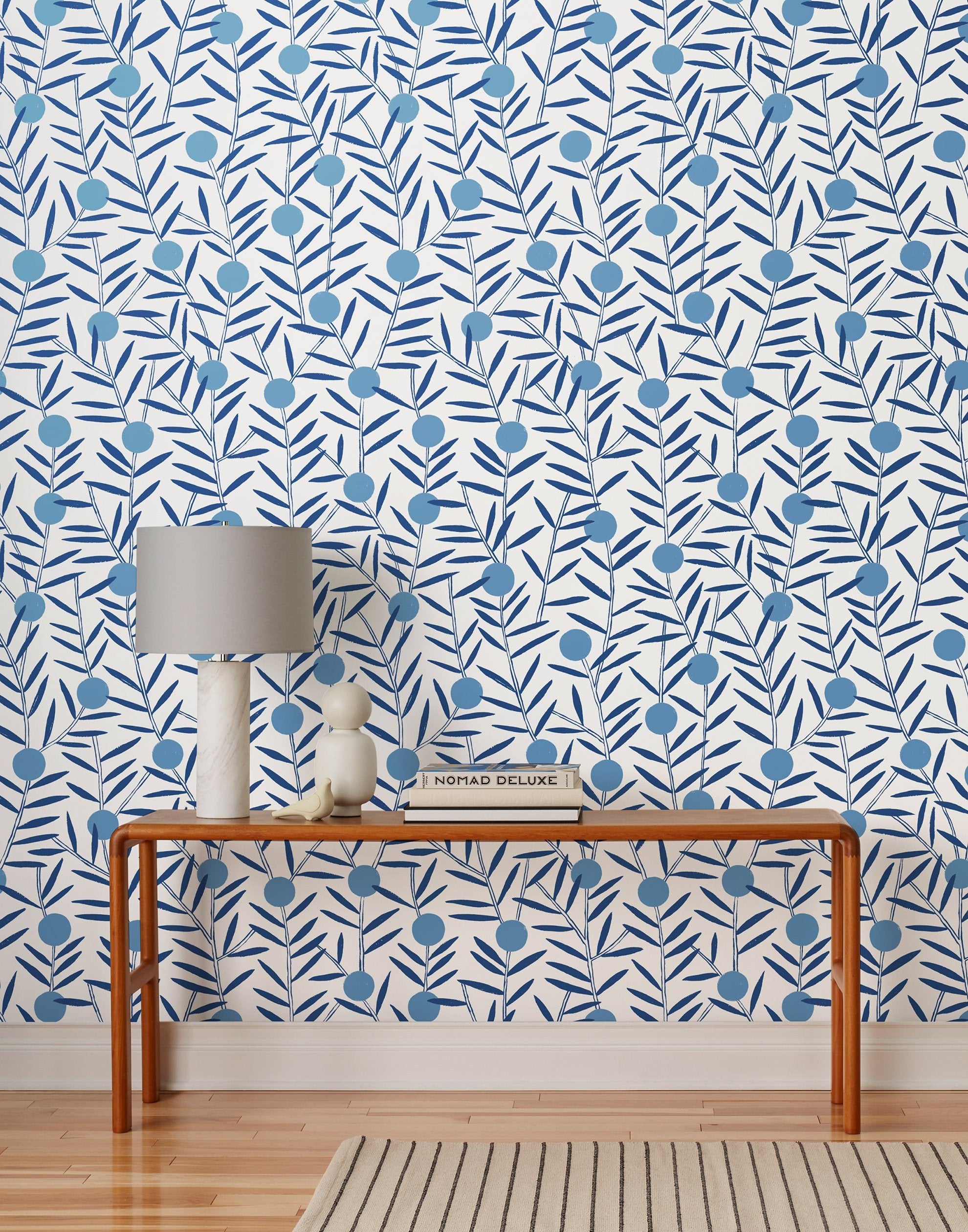 Bloom (Bluebell) Wallpaper featuring dusty blue dots and deep blue stems on a white ground in a modern, graphic floral 
