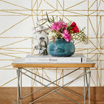 Strike (Gold) features modern, geometric metallic gold lines on white