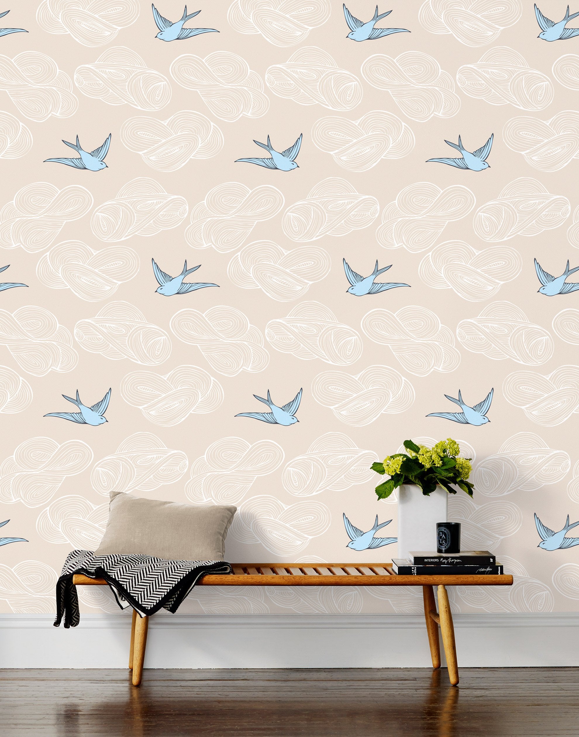 Daydream (Cream) features a pattern of flying birds and floating clouds in blue and white on cream