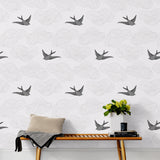 Daydream (Light Gray) features a pattern of flying birds and floating clouds in gray on white