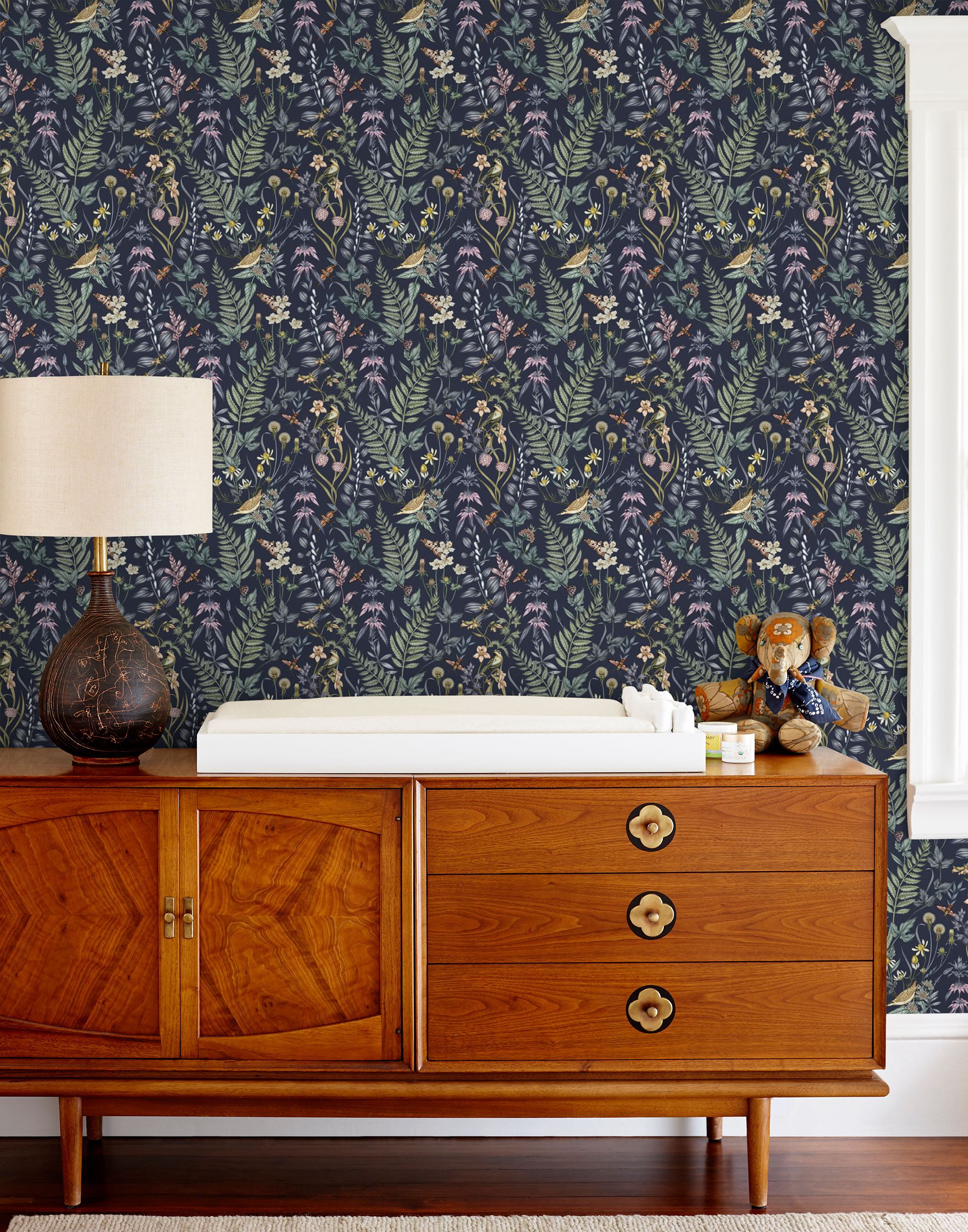 Secret Garden (Amethyst) wallpaper features shades of green, brown, purple, and pink plants, birds and butterflies on dark purple background