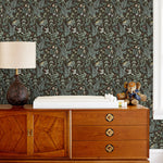 Secret Garden (Sable) wallpaper features shades of green, blue, lilac, and taupe plants, birds and butterflies on brown background