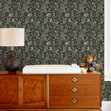 Secret Garden (Sable) wallpaper features shades of green, blue, lilac, and taupe plants, birds and butterflies on brown background