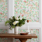 Summer (Poppy) wallpaper features loose brushstrokes that capture the movement of wild flowers and grasses swaying in the breeze. Bright red, lavender purple, and green watercolored flora on a white background | Hygge & West