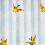 Daydream (Sunshine) Shower Curtain features a pattern of flying birds and floating clouds in yellow and blue on white