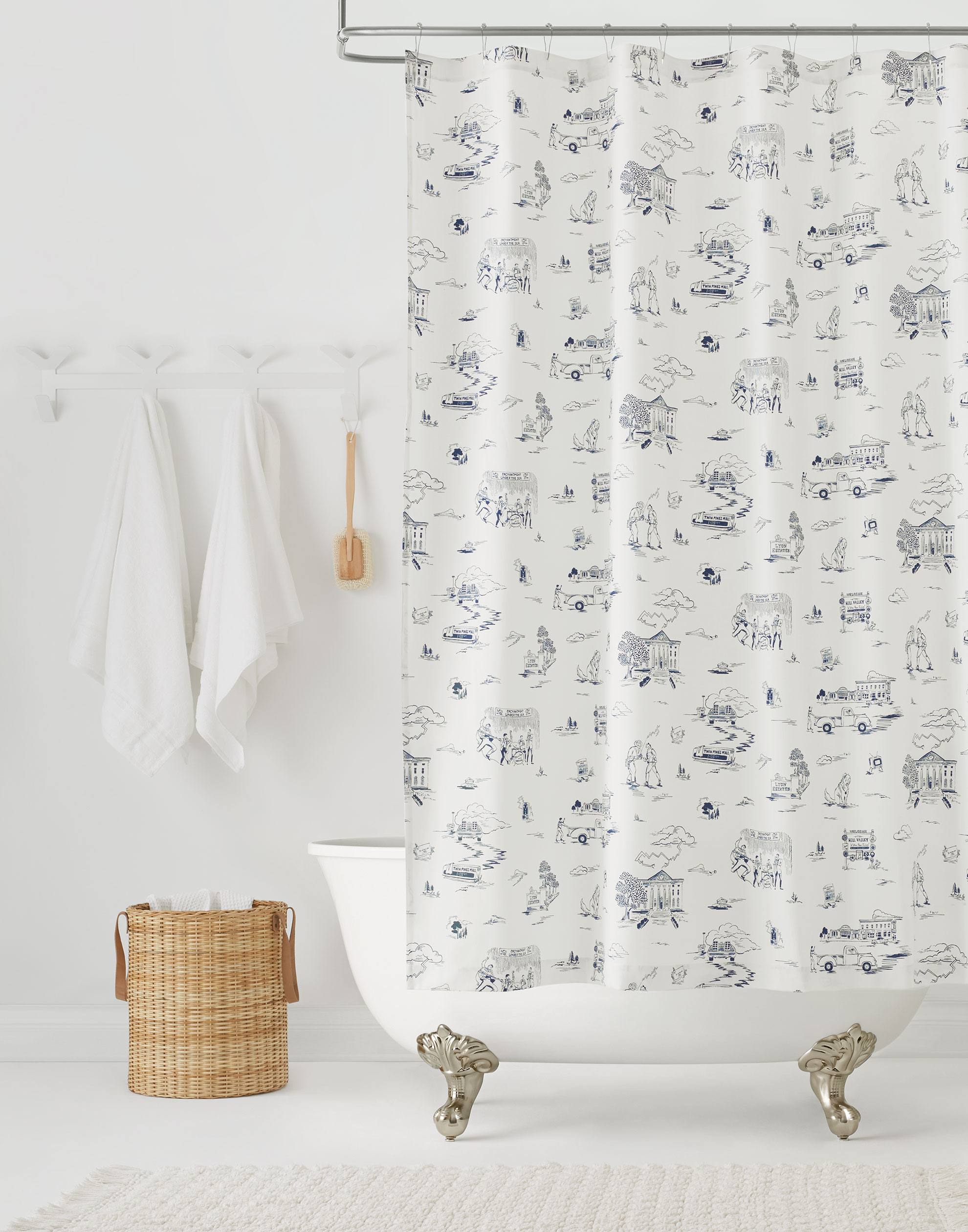 Hill Valley Toile (Denim) Shower Curtain with navy blue illustrations on a white background depicts scenes from the iconic movie Back to the Future and was created in collaboration with Universal | Hygge & West