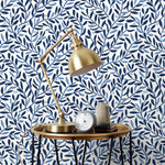 Olive Grove (Blue) featuring a leafy vine motif in shades of blue with light blue accents on a true white background | Schoolhouse x Hygge & West Wallpaper Collection