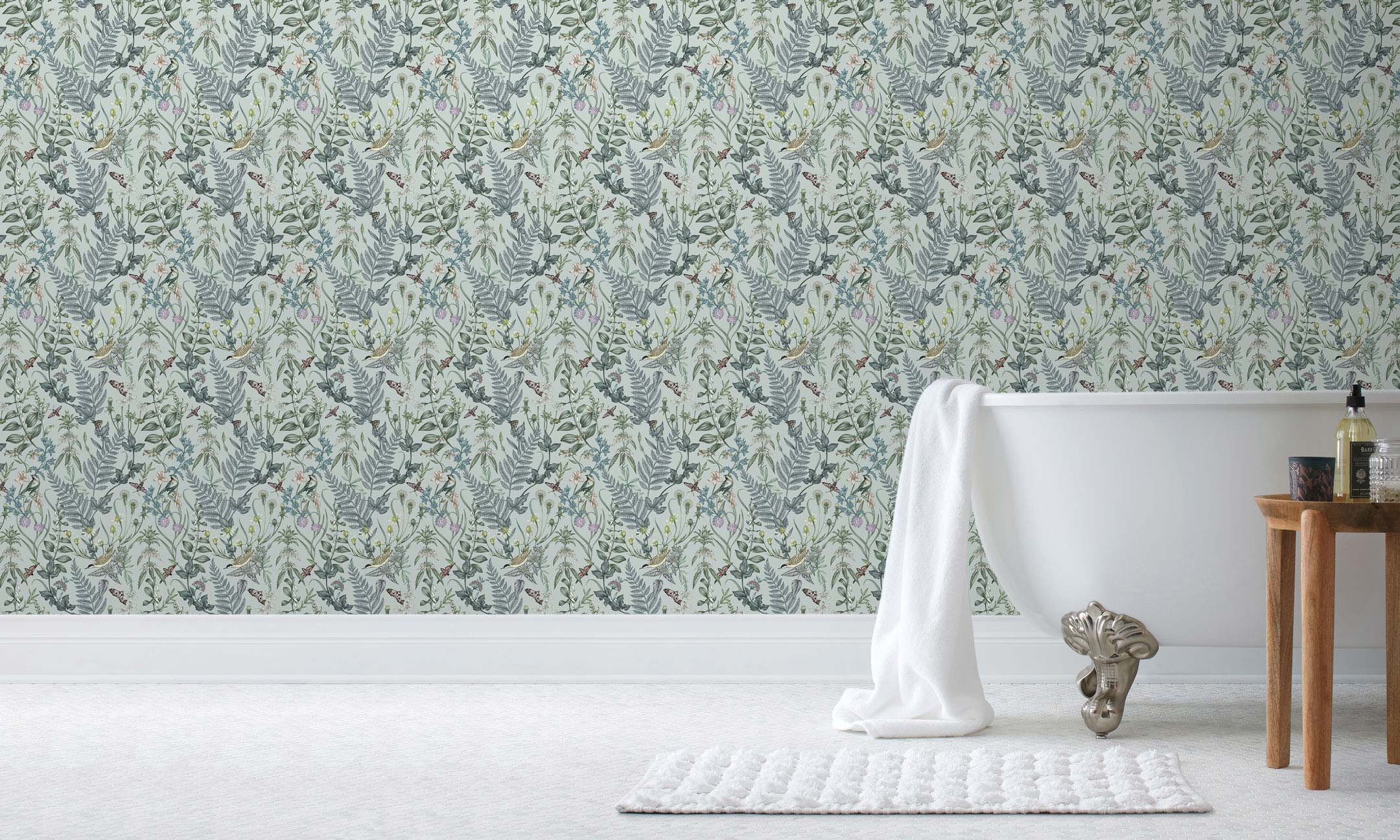 Secret Garden (Robin Egg) wallpaper features shades of green, blue and brown plants, birds and butterflies on a robin egg blue background